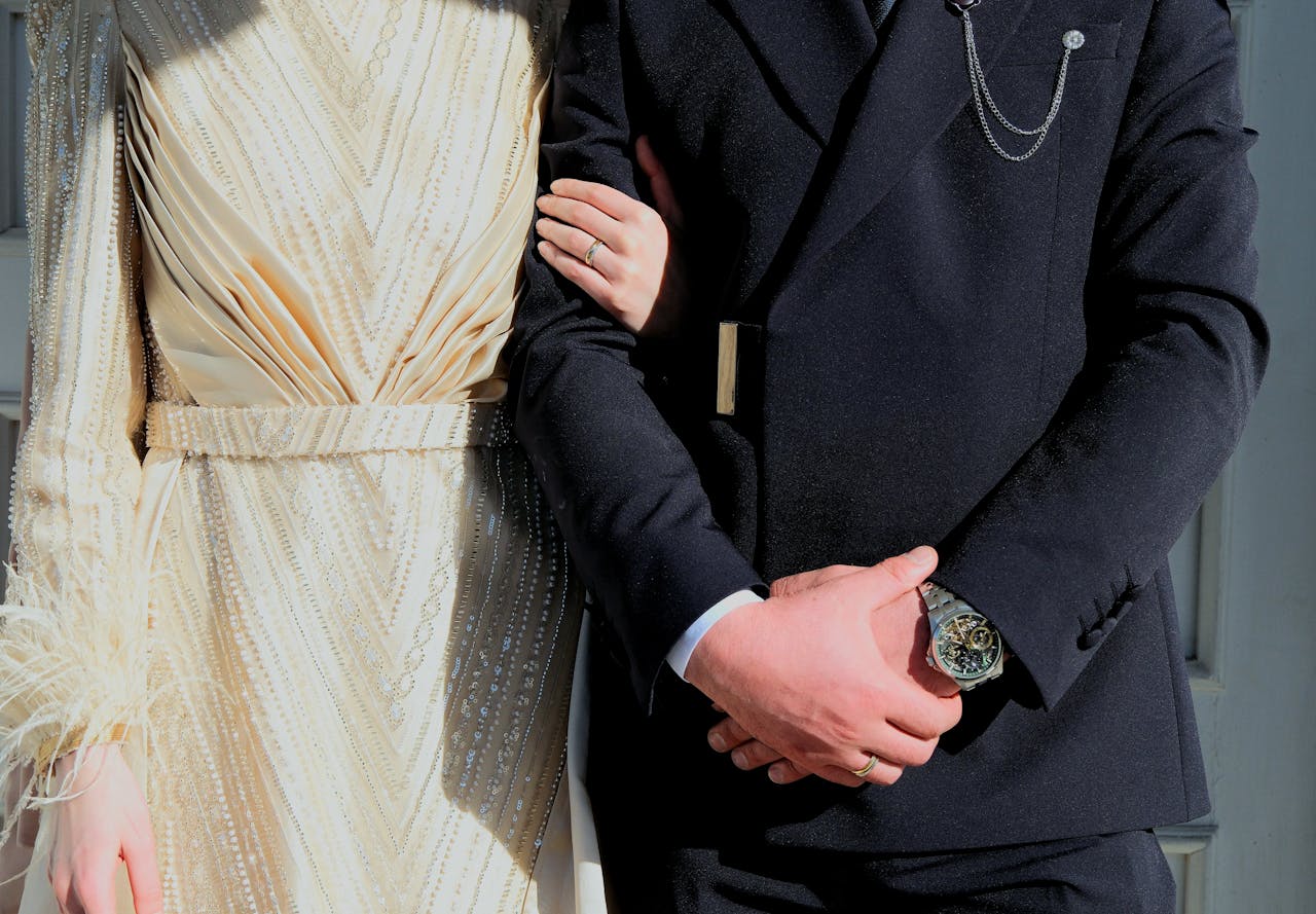 Mastering the First Impression: Your intriguing post title goes here A fashionable couple in formal attire embracing warmly, showcasing luxury fashion.